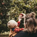 Mother and Son Picking Apples