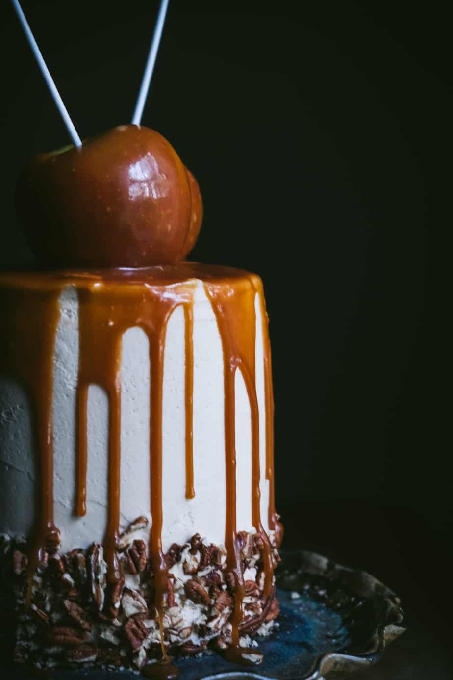 close up photo of caramel and apples on a cake