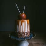 caramel apple cake on a cake stand