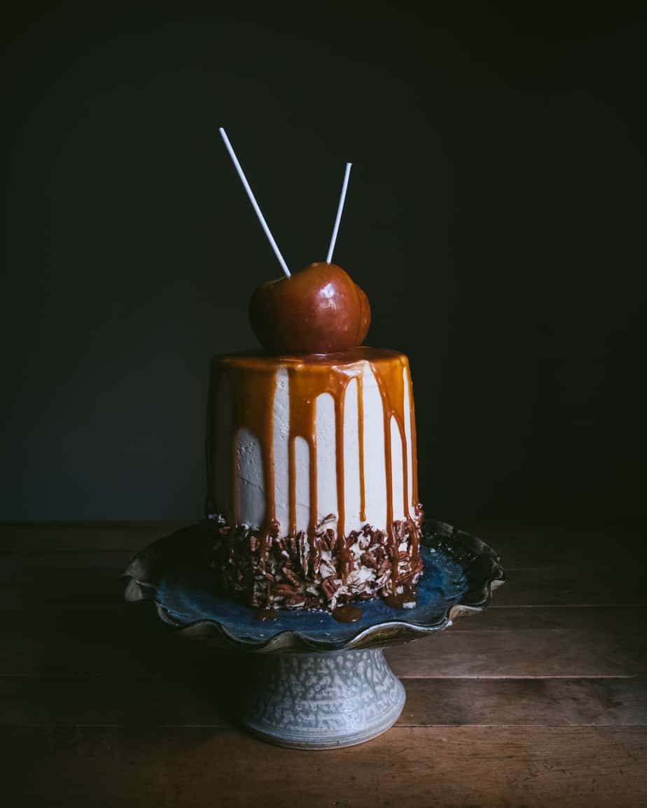 caramel apple cake on a cake stand