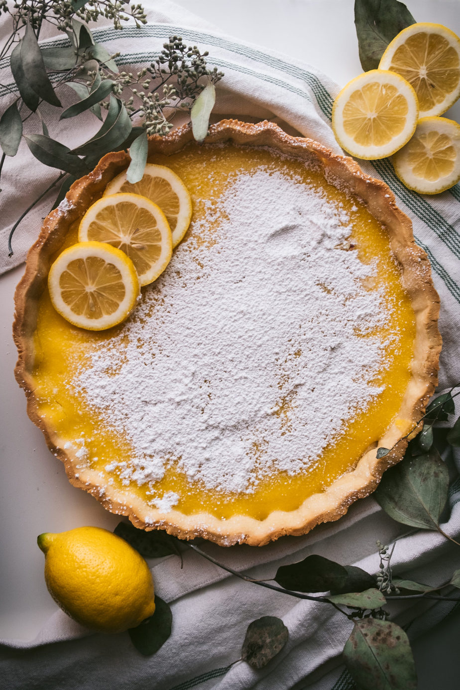 flatlay of citrus dessert (lemon tart)