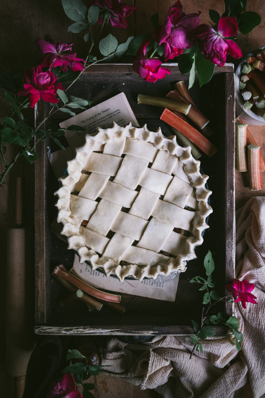 pie flatlay with rhubarb and roses